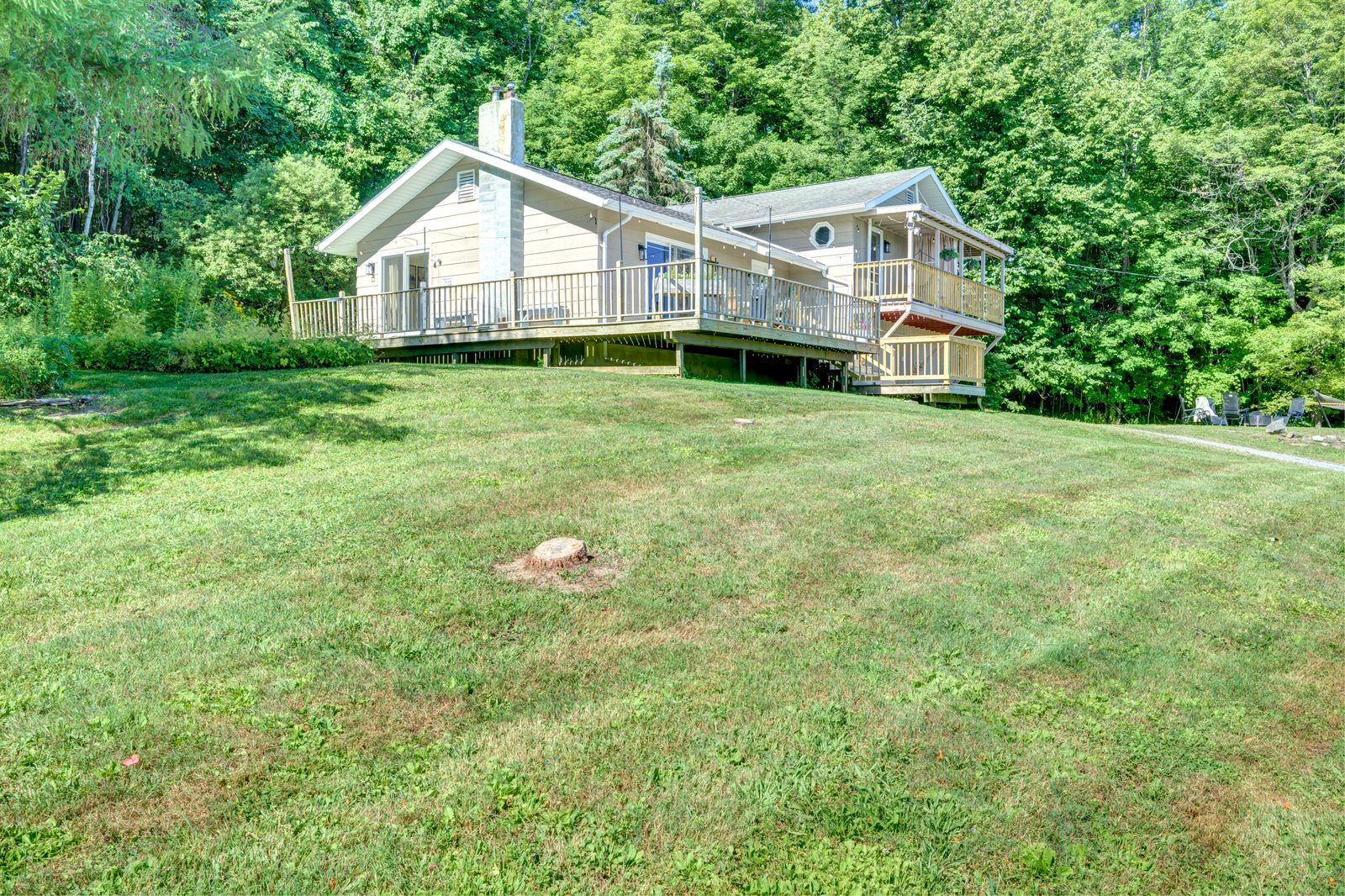 The house seen across the summer field